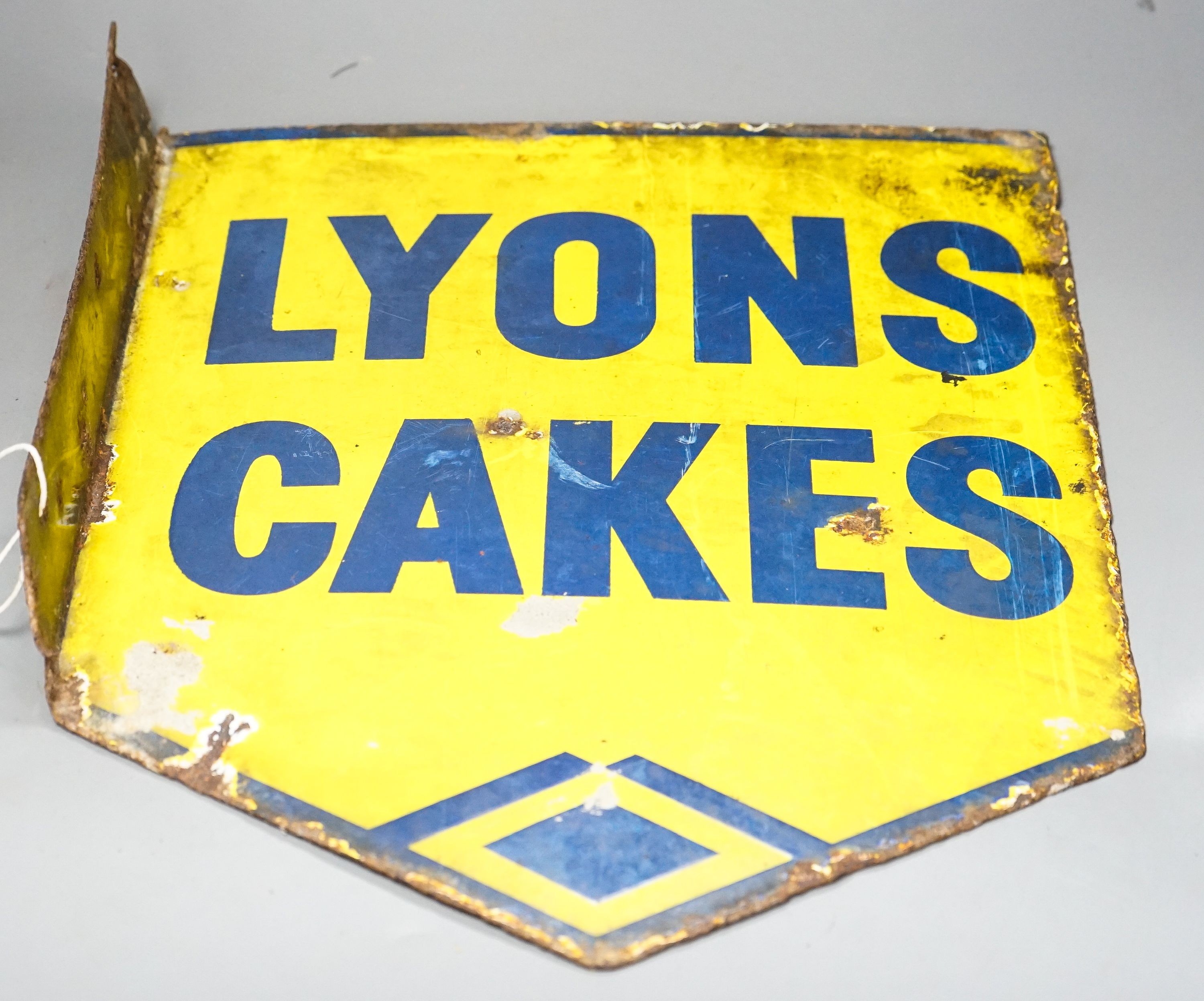 A Lyons Cakes yellow ground enamelled sign 40x32cm